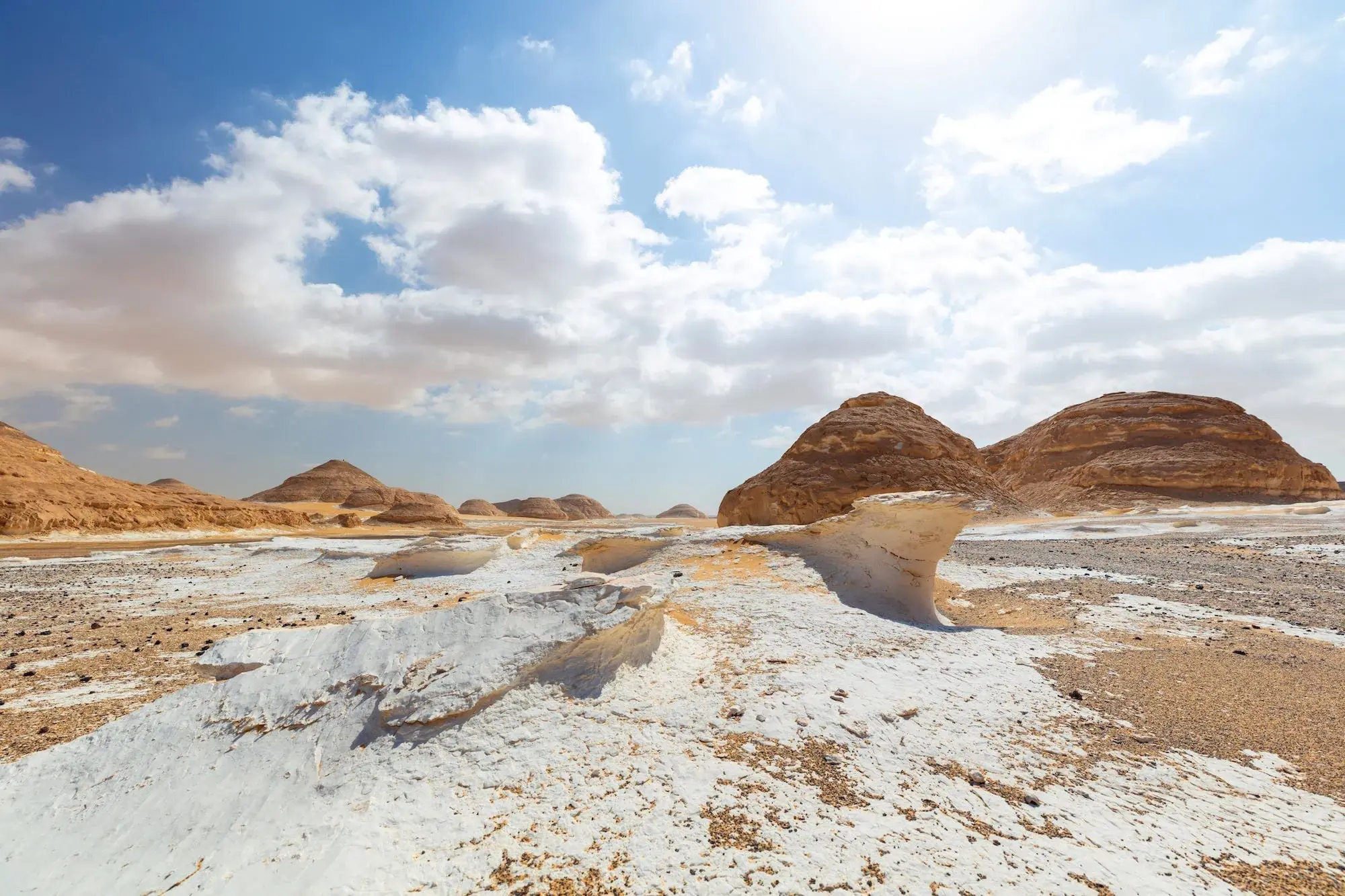 Chalk-white wind-sculpted rock formations on the desert floor at Bahariya Oasis in Egypt's Western Desert.
